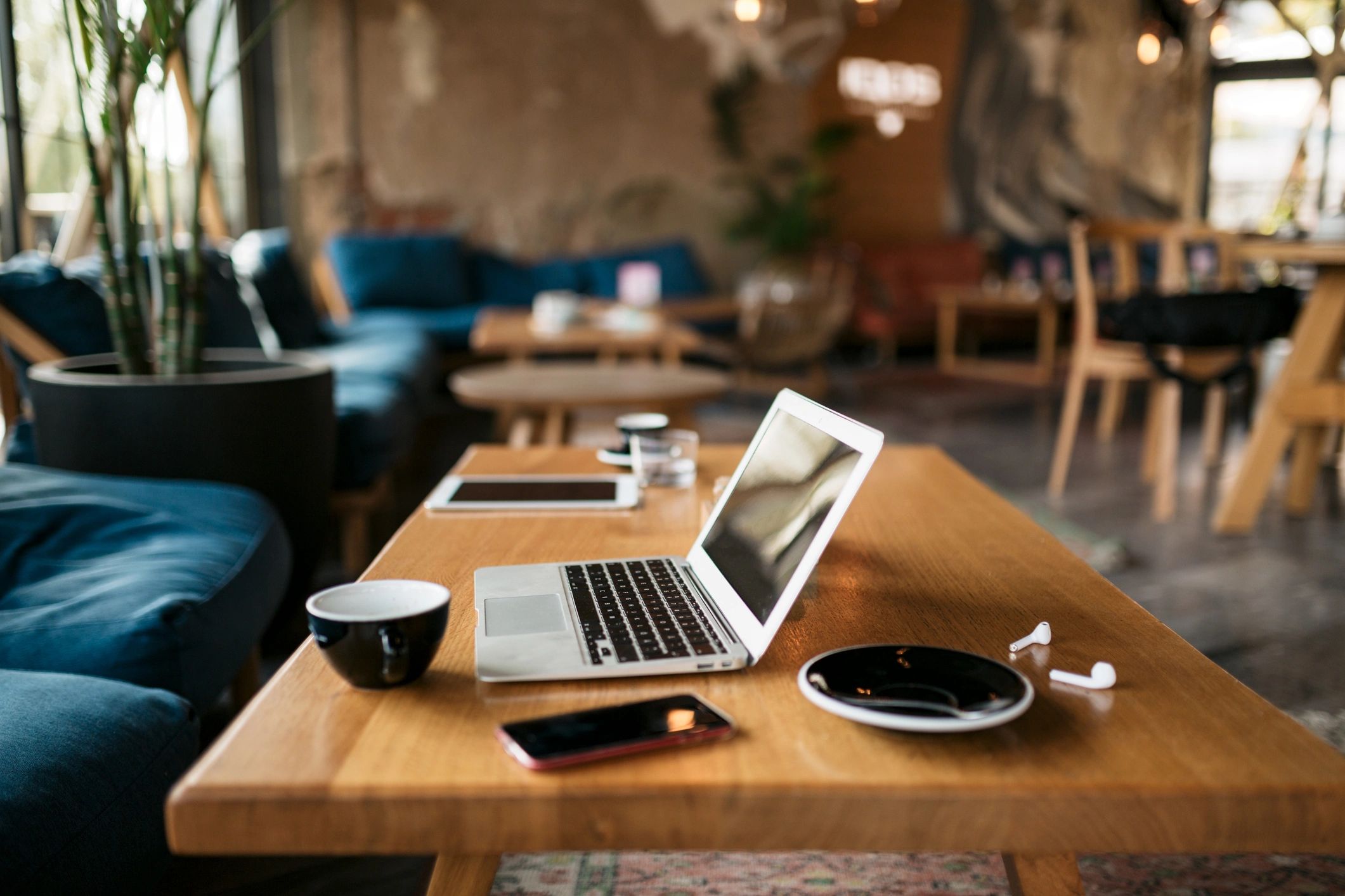 Laptop and travel items representing subscription access for relocation planning