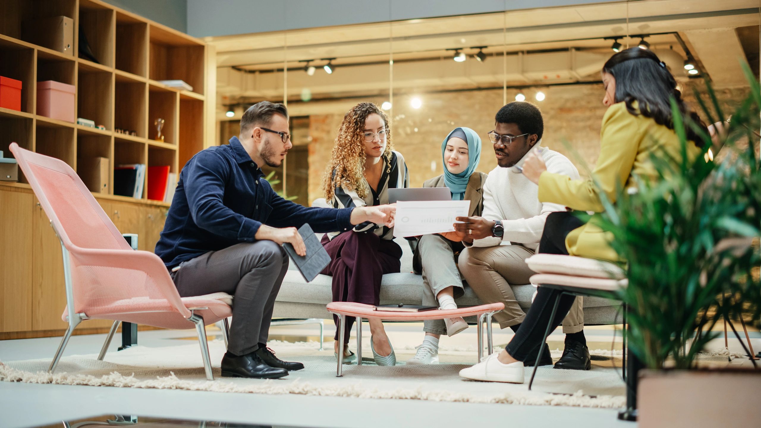 Team collaborating in a modern office meeting room