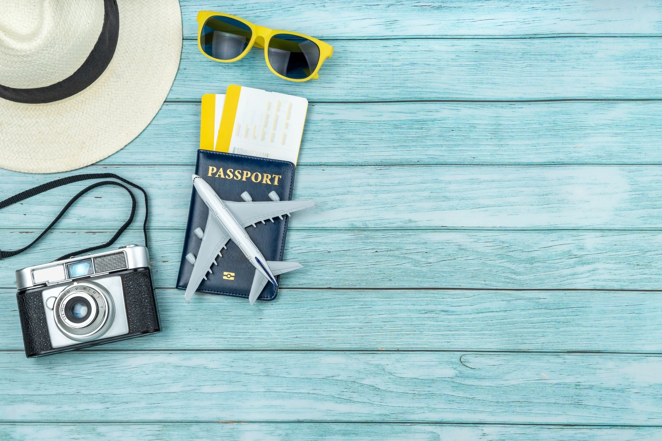 Passport and travel items laid out on a table